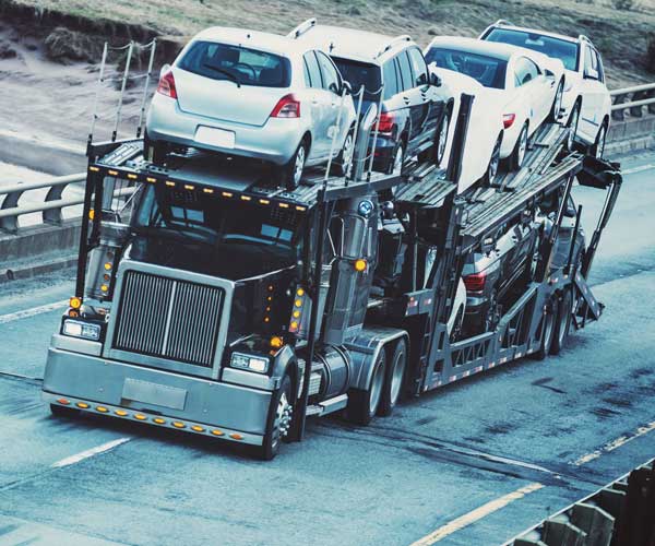 A semi pulling a load of cars.