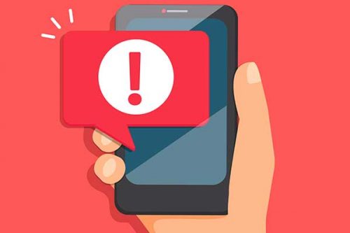 Illustration of a hand holding a cellphone with a red alert.