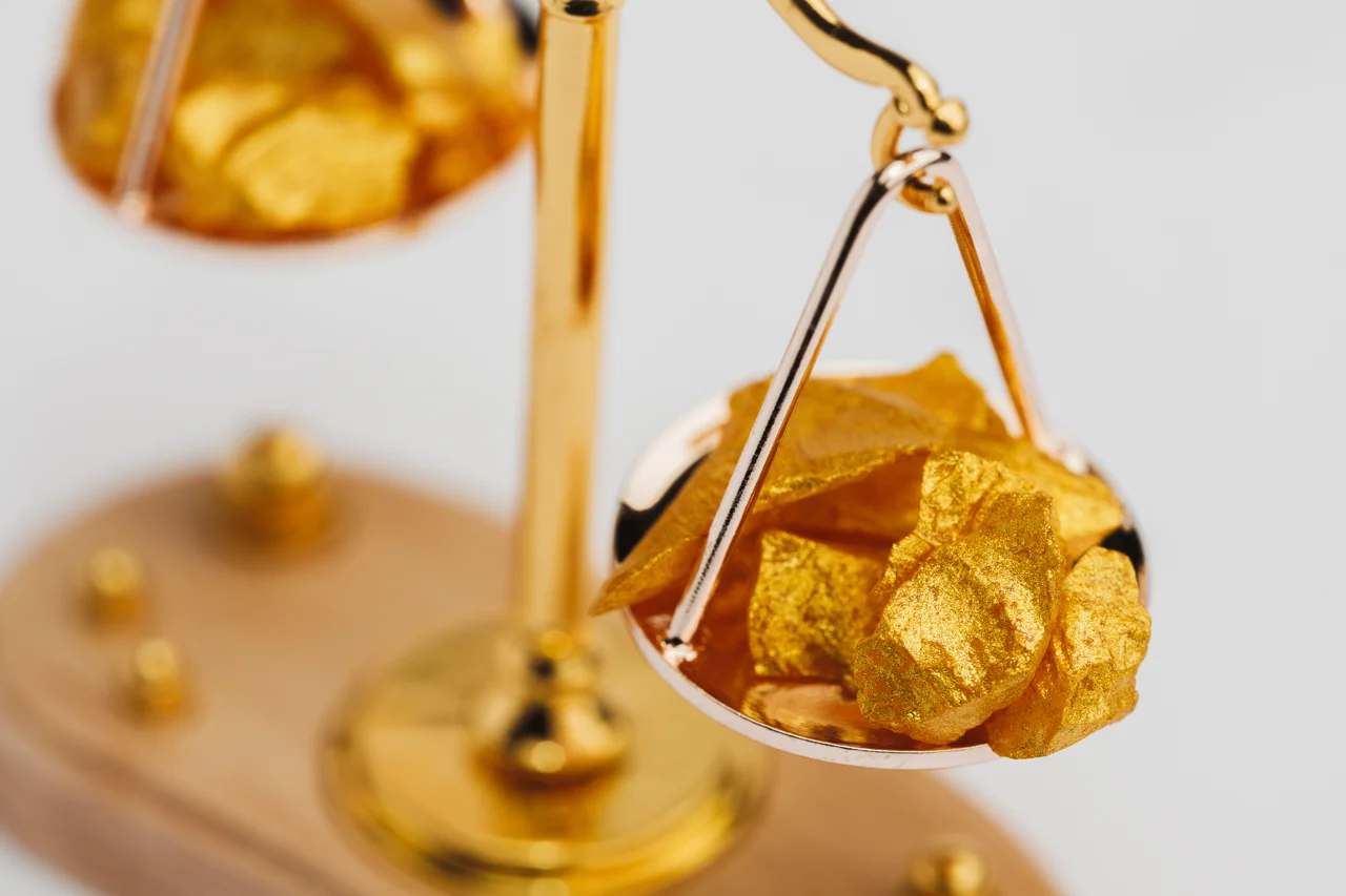 golden-balance-scales-with-little-pieces