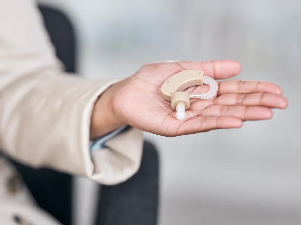 hearing-aid-medical-and-deaf-with-hands-of-person
