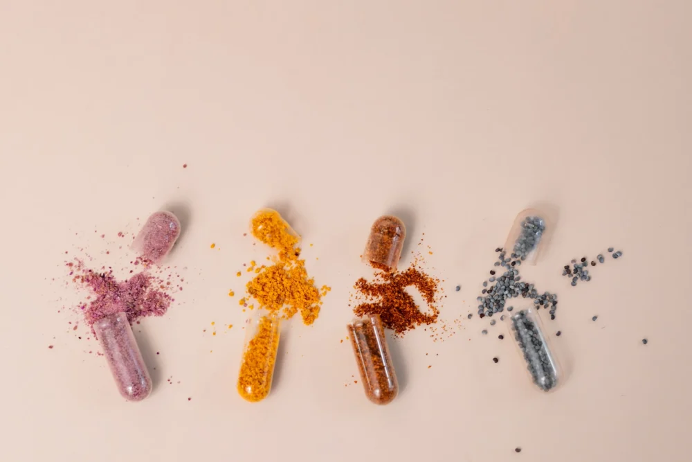 A group of broken pills sitting next to each other : Photo by laura adai on Unsplash